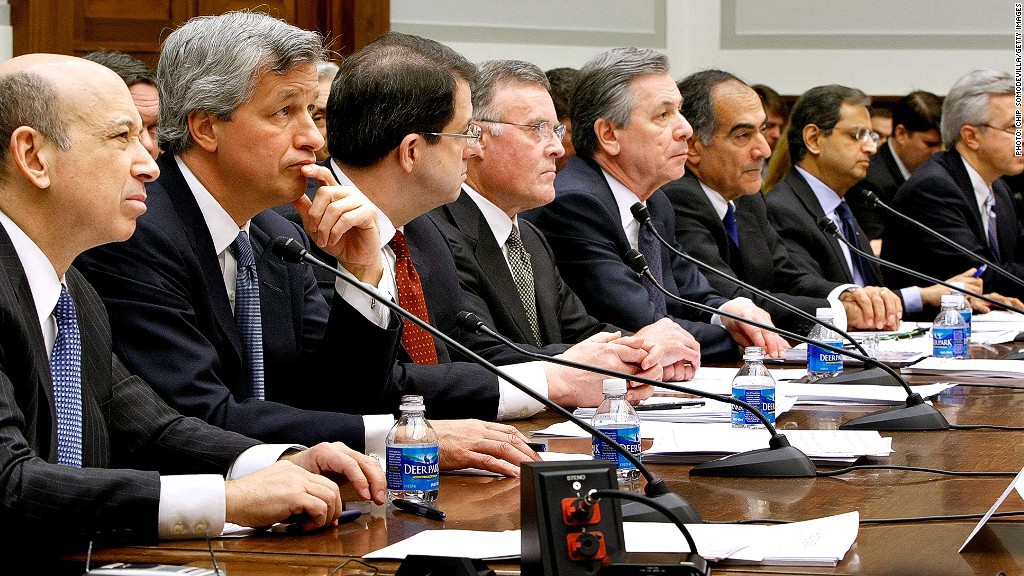 WASHINGTON - FEBRUARY 11: Executives from the financial institutions who received TARP funds, (L-R) Goldman Sachs Chairman and CEO Lloyd Blankfein, JPMorgan Chase & Co CEO and Chairman Jamie Dimon, The Bank of New York Mellon CEO Robert P. Kelly, Bank of America CEO Ken Lewis, State Street Corporation CEO and Chairman Ronald Logue, Morgan Stanley Chairman and CEO John Mack, Citigroup CEO Vikram Pandit, Wells Fargo President and CEO John Stumpf testify before the House Financial Services Committee February 11, 2009 in Washington, DC. The hearing focused on how financial institutions have spent funds received from the Troubled Asset Relief Program (TARP). (Photo by Chip Somodevilla/Getty Images) *** Local Caption *** Lloyd Blankfein;Jamie Dimon;Robert P. Kelly;Ken Lewis;Ronald Logue;John Mack;Vikram Pandit;John Stumpf